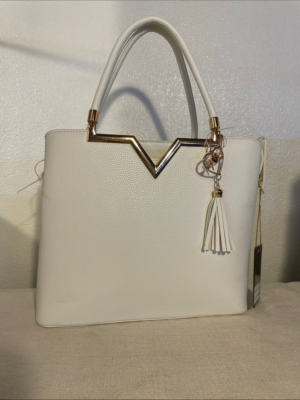 Crossi Structured White Tote with Gold Accent and Tassel Charm